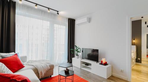 Μια τηλεόραση ή/και κέντρο ψυχαγωγίας στο Apartamenty Homely Place Serce Poznania - Stary Rynek - Parking