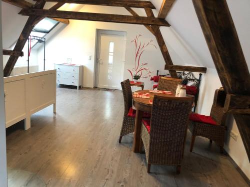 a dining room with a table and chairs at Apartment Maria in Kürten