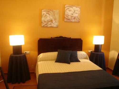 Ein Bett oder Betten in einem Zimmer der Unterkunft Apartamentos De Turismo Rural Heredero