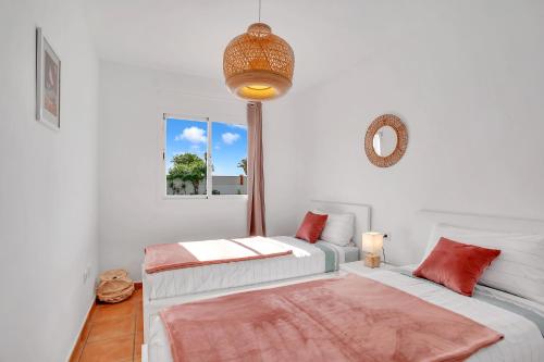 A bed or beds in a room at CASA DUNAS