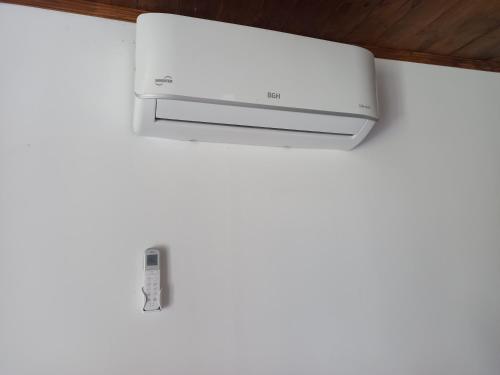 a printer on top of a white wall at Cabaña El Encuentro in San Carlos de Bolívar
