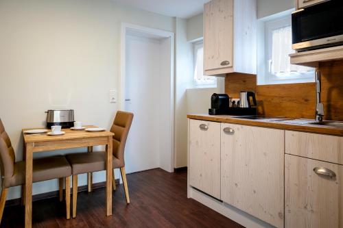 Η κουζίνα ή μικρή κουζίνα στο Insulaner Apartments