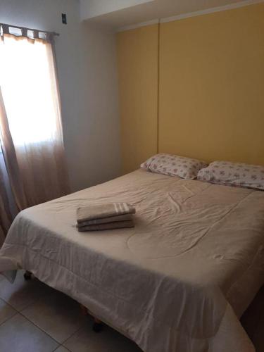 Ένα ή περισσότερα κρεβάτια σε δωμάτιο στο Gadano Suites