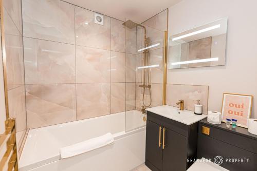 a bathroom with a shower and a sink at New and Modern 1bed, 10 min to beach town parking - To Be Shore in Bournemouth