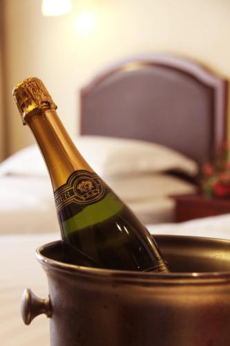 a bottle of champagne sitting in a pot at Beijing Landmark Towers in Beijing