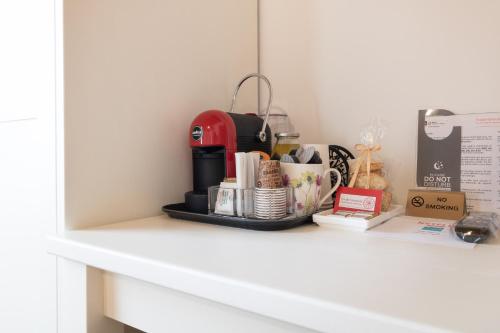 a shelf with a coffee maker and other items on it at Agriturismo Fondo Gioconda in Marcon