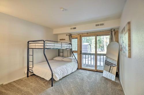 a bedroom with a bunk bed and a balcony at Tahoe City Home with Hot Tub - 1 Mi to Beach in Tahoe City