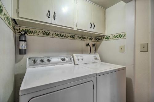a kitchen with a white dishwasher and white cabinets at Tahoe City Home with Hot Tub - 1 Mi to Beach in Tahoe City
