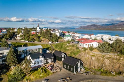 an aerial view of a small town on a hill at Englendingav&iacute;k Homestay in Borgarnes