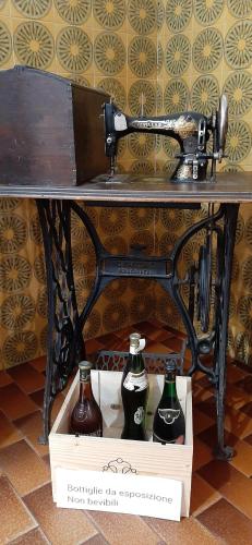 a table with two bottles on top of a box at La Beccaccia in Baceno