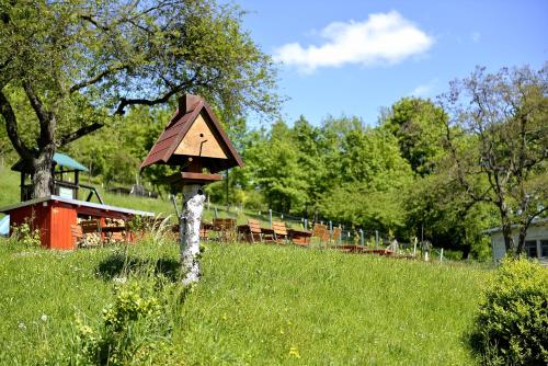 a bird house on a tree in a field at Land- und Golfhotel Alte Fliegerschule in Eisenach