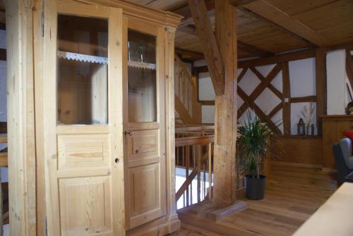 a room with a wooden door in a house at Ferienwohnung Hiemer in Bad Grönenbach