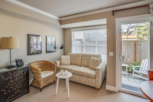 a living room with a couch and a chair at Cannon Beach Hotel Collection in Cannon Beach