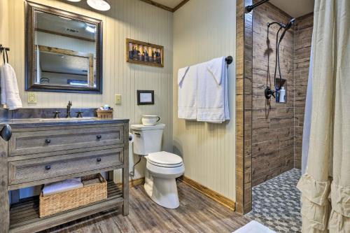 a bathroom with a toilet and a sink and a shower at Cozy Fredericksburg Studio Near Wineries! in Fredericksburg