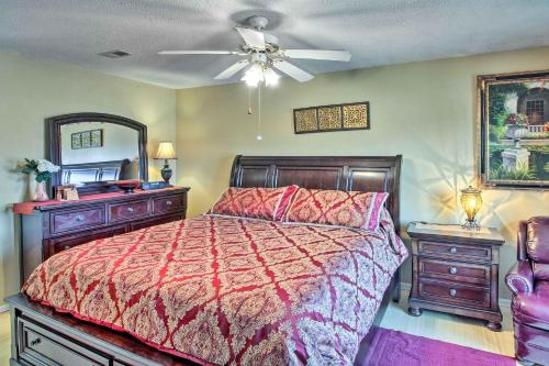 a bedroom with a bed and a ceiling fan at Central Kansas City Home Less Than 3 Mi to Downtown! in Kansas City