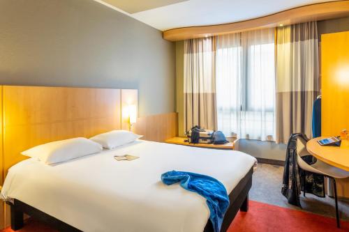 Cama o camas de una habitación en ibis Hotel Brussels Centre Gare du Midi