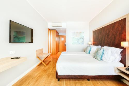 Кровать или кровати в номере Vila Baleira Funchal