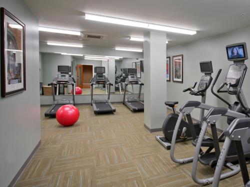 a gym with several treadmills and exercise bikes at Staybridge Suites Baltimore - Inner Harbor by IHG in Baltimore