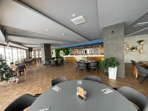 a restaurant with tables and chairs and a bar at The Best Apartment on the beach 'Caesar Beach' Bogaz, North Cyprus in Boğaz