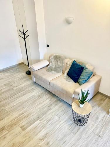 a living room with a couch and a potted plant at TIME TO ESCAPE in Tirano