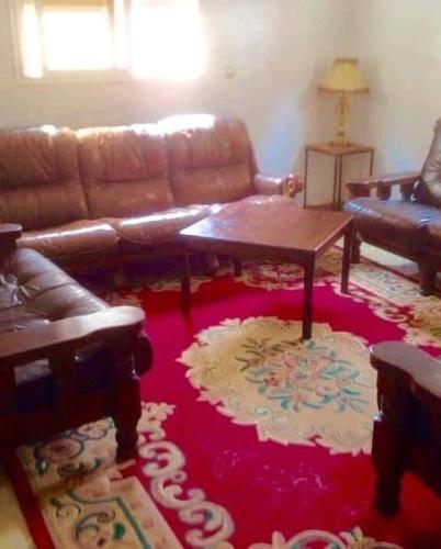 a living room with a couch and a coffee table at Vacances à petit prix Lot Shems in Safi