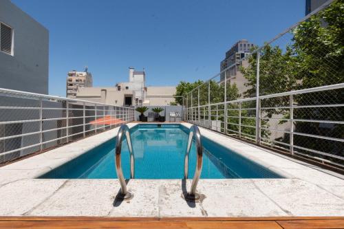 a swimming pool on the roof of a building at Hotel Bys Palermo in Buenos Aires
