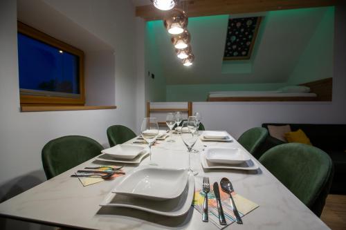 a table with plates and napkins on top at AppPrusnik in Ljubljana