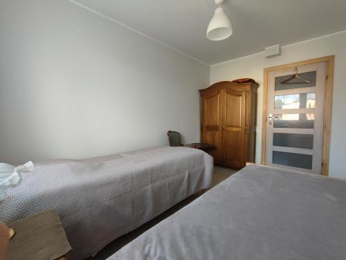 Una cama o camas en una habitación de agro NOCLEGI