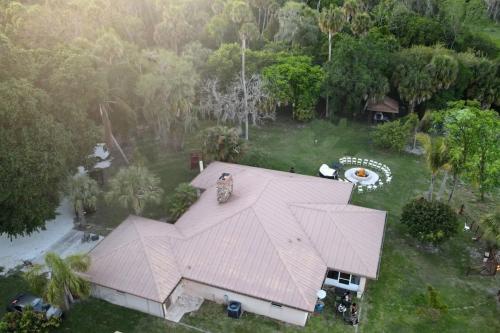 an overhead view of a house with a large roof at Beautiful Vacation Home Across From Lake Okeechobee in Okeechobee