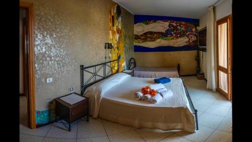 Postel nebo postele na pokoji v ubytování villa Orchidee Sardegna