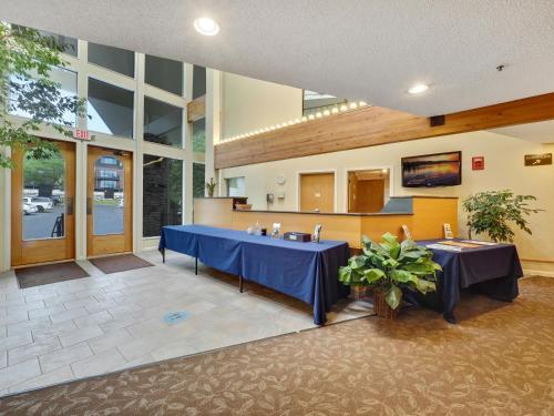 a room with two tables in a building at 117A Edgewater Inn Condo in Charlevoix