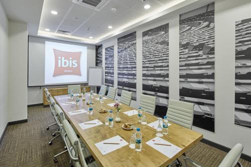 a conference room with a long table and chairs at ibis Ankara Airport Hotel in Ankara