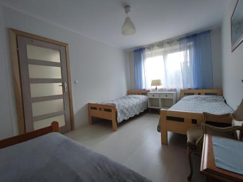 Una cama o camas en una habitación de agro NOCLEGI