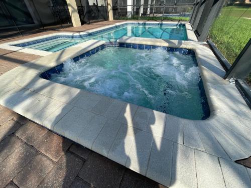 a jacuzziificialificialificialificialificialificialificialificialificialificialificial at Tropical Nights - 8 bed ChampionsGate Resort family pool home in Davenport