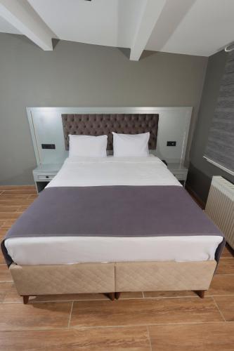 a bedroom with a large bed in a room at Ortakoy Aysem Sultan Hotel in Istanbul