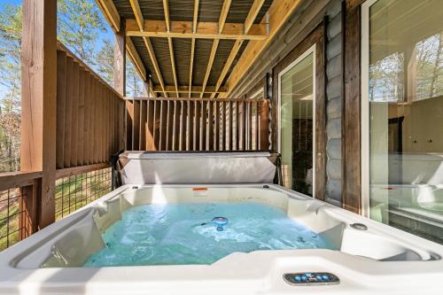 a soaking tub on the back of a house at Hideaway Pointe in Sevierville