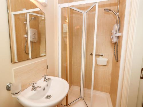 a bathroom with a sink and a shower at Rocklands House in Beaufort