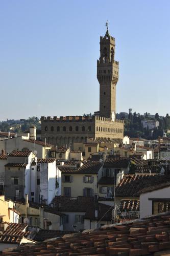 a view of a city with a clock tower at Brunelleschi Hotel in Florence