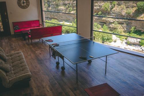 a ping pong table in the middle of a room at Auto kamp Titograd in Podgorica