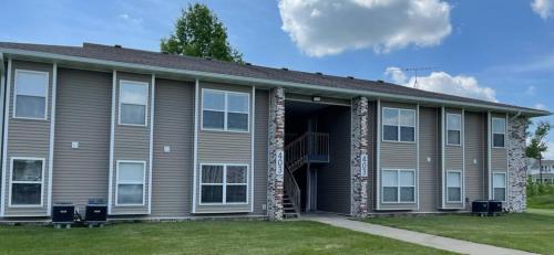 a house with its door open with a porch at The Deannie Apt #6 - Simple and Homey 2bd w/ WiFi in Hamilton