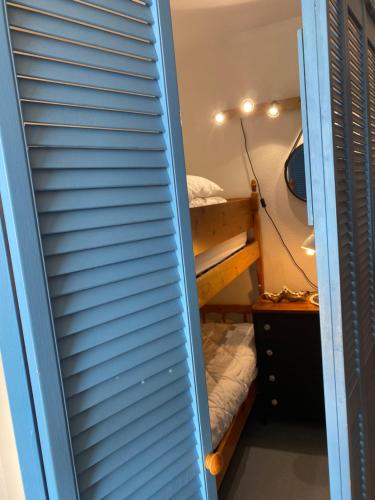 a bunk room with two bunk beds in it at Les Marinas de Cassy in Lanton