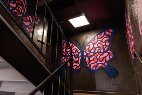 a group of butterflies on the side of a staircase at voco The Darwin - Atlanta Midtown by IHG in Atlanta