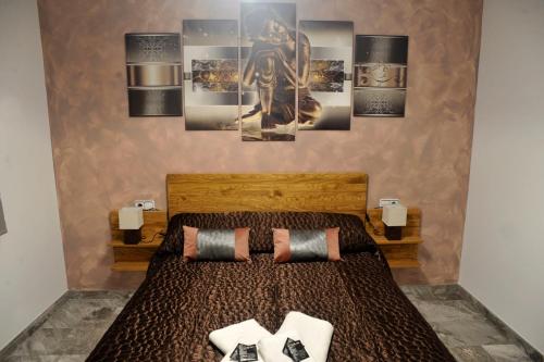 a bedroom with a bed with two pillows at River Dreams in Deltebre