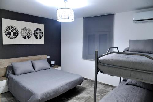 a bedroom with two bunk beds and a bed at River Dreams in Deltebre