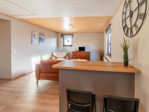 a living room with a bar and a couch at Holiday home in Léglise with garden in Léglise