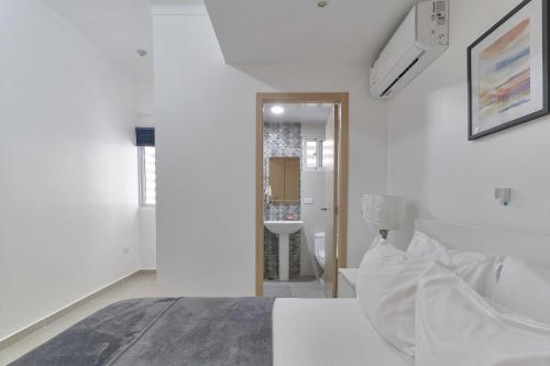 Postel nebo postele na pokoji v ubytování Dom. Rep. Exclusive 2 bed Apt. Evaristo Morales