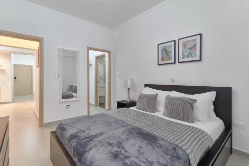 Postel nebo postele na pokoji v ubytování Dom. Rep. Exclusive 2 bed Apt. Evaristo Morales
