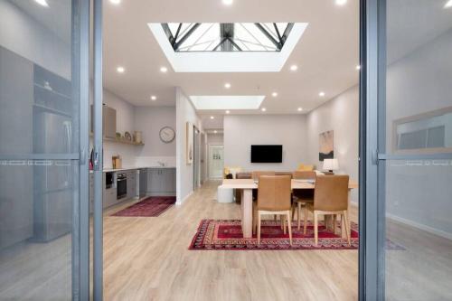 a dining room and kitchen with a table and chairs at The Ranch In The Heart Of Launceston w/ Free Wifi in Launceston