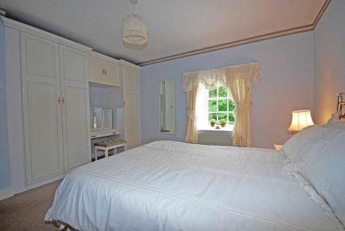 Postel nebo postele na pokoji v ubytování Croft Cottage Yeavering