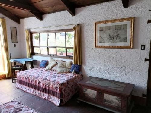 Ένα ή περισσότερα κρεβάτια σε δωμάτιο στο La Casa de la Abuela